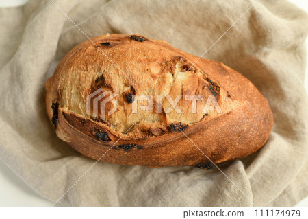 Delicious bread with figs on a natural beige background Delicious bread with figs on a natural beige background 111174979