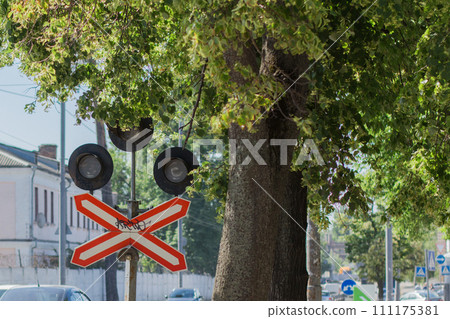 traffic light at a railway crossing on the road traffic light at a railway crossing on the road 111175381