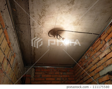 repair in a brick building at a construction site 111175580