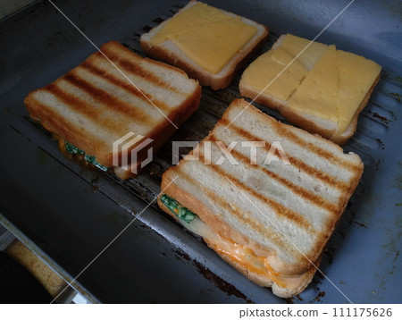 sandwiches on frying pan in the kitchen fried 111175626