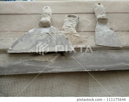 spatula for painters on a wooden chair spatula for painters on a wooden chair 111175646