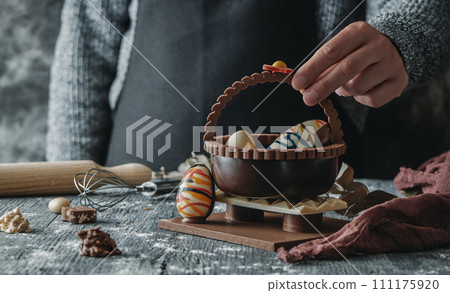 man with a chocolate basket as spanish mona de pascua man with a chocolate basket as spanish mona de pascua 111175920