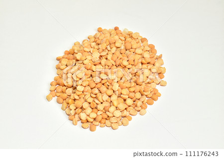 Peeled and dried peas on a white background. Peeled and dried peas on a white background. 111176243
