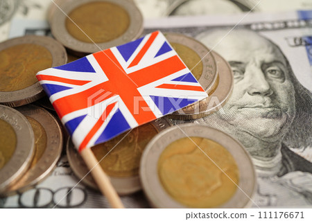 United Kingdom flag on coin and banknote money, finance trading investment business currency concept. 111176671