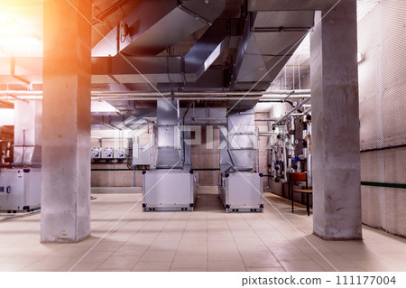 Interior industrial gas boiler with a lot of piping, pumps and valves 111177004