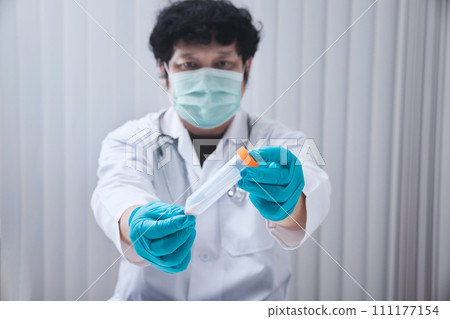 Doctor or medical staff is collecting secretions from patient for examination in the lab. Pandemic Coronavirus, COVID-19. Doctor or medical staff is collecting secretions from patient for examination in the lab. Pandemic Coronavirus, COVID-19. 111177154