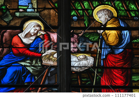 Stained glass with a scene of the birth of Jesus Christ Stained glass with a scene of the birth of Jesus Christ 111177401