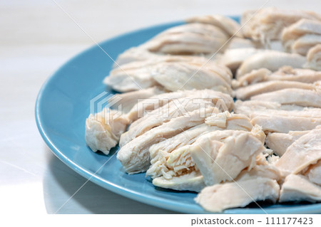 boiled chicken meat on blue plate boiled chicken meat on blue plate 111177423