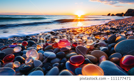 Beach with color pebbles in the sea coast, in the background sea and waves with sunset and sky. 111177471