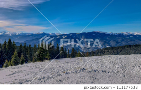 Panoramic view over Carpathian Mountains in wintertime. Panoramic view over Carpathian Mountains in wintertime. 111177538
