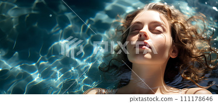 Beautiful woman is in a clear and clean blue swimming pool. She closed her eyes and relaxed. The sun shines on her She is enjoying the summer vacation. This image represents happiness and relaxation. 111178646