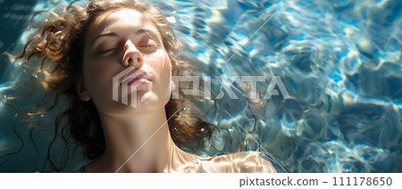 Beautiful woman is in a clear and clean blue swimming pool. She closed her eyes and relaxed. The sun shines on her She is enjoying the summer vacation. This image represents happiness and relaxation. Beautiful woman is in a clear and clean blue swimming pool. She closed her eyes and relaxed. The sun shines on her She is enjoying the summer vacation. This image represents happiness and relaxation. 111178650