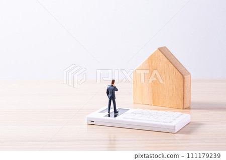 A man thinking about buying a home A man thinking about buying a home 111179239
