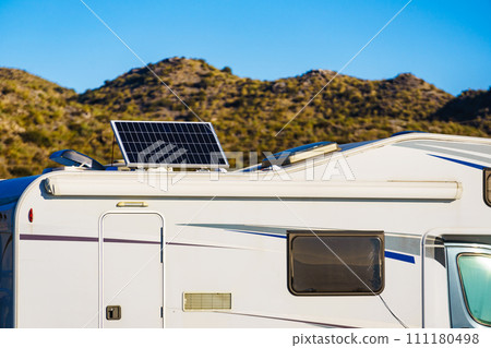 Caravan with tilt solar panels on roof. Caravan with tilt solar panels on roof. 111180498