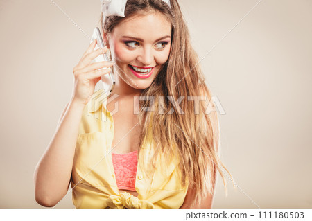 Retro pin up girl talking on mobile phone 111180503