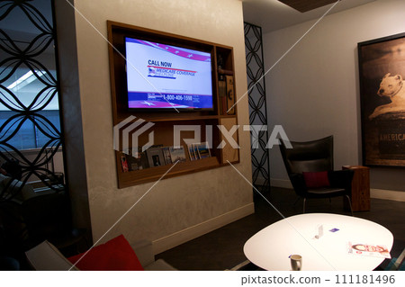 SAN FRANCISCO, CALIFORNIA, UNITED STATES - NOV 28, 2018: Relaxation area with TV in an airport lounge at San Francisco International Airport SFO 111181496