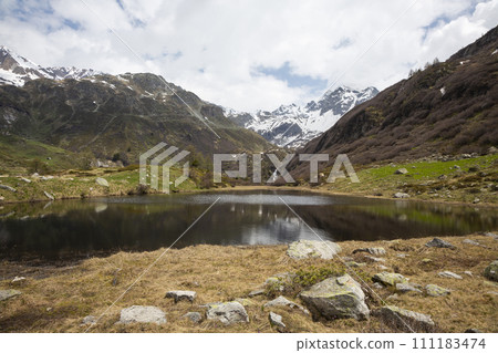 Landscape with Halsensee lake in Binnatal or Binntal valley in Valais Switzerland. Landscape with Halsensee lake in Binnatal or Binntal valley in Valais Switzerland. 111183474