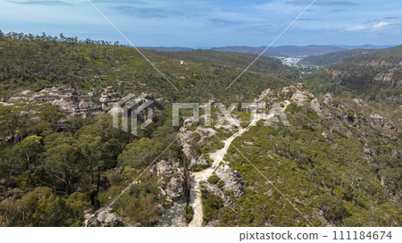 Aerial photograph of rock formations in the Gardens of Stone State Conservation area near Lithgow in regional Australia Aerial photograph of rock formations in the Gardens of Stone State Conservation area near Lithgow in regional Australia 111184674