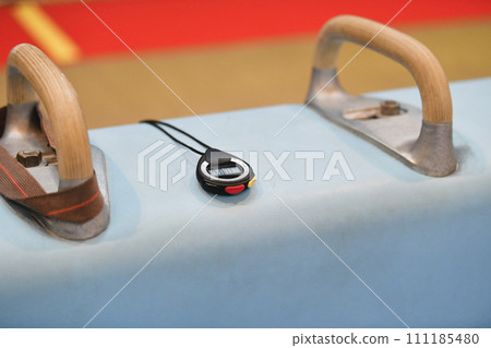 Pommel horse and stopwatch in the gym Gymnastic equipment Pommel horse and stopwatch in the gym Gymnastic equipment 111185480