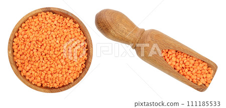 red lentil in wooden bowl and scoop isolated on white background. Top view red lentil in wooden bowl and scoop isolated on white background. Top view 111185533