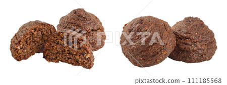 chocolate cookie with kerob, banana, cashew, sunflower seeds and coconut paste isolated on white background. Healthy food, gluten-free, flour-free chocolate cookie with kerob, banana, cashew, sunflower seeds and coconut paste isolated on white background. Healthy food, gluten-free, flour-free 111185568