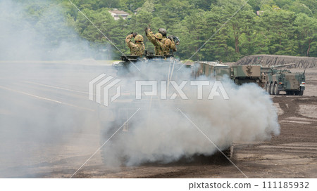 Japan Ground Self-Defense Force Type 90 tank recovery vehicle spewing smoke 111185932