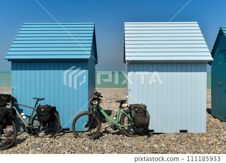 Blue wooden houses and bikes on the ocean Dieppe Blue wooden houses and bikes on the ocean Dieppe 111185933
