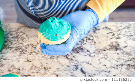 Using buttercream frosting, vanilla and chocolate cupcakes are intricately decorated to resemble various types of cactuses, creating a delightful and visually engaging dessert that showcases Using buttercream frosting, vanilla and chocolate cupcakes are intricately decorated to resemble various types of cactuses, creating a delightful and visually engaging dessert that showcases 111186253
