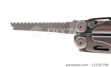 A steel multi-tool or pocket knife with an open saw lies on a white background. Compact and portable multi-tasking multitool with many tools. EDC concept. A tool for daily practice. All in one 111187709