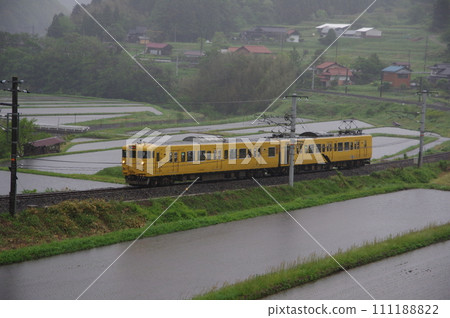 Local train 113 series Hakubi Line near Iwami in the rain Local train 113 series Hakubi Line near Iwami in the rain 111188822