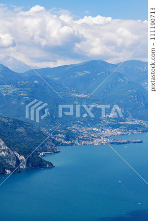 Mountain landscape, picturesque mountain lake in the summer morning, large panorama. Iseo, Italy Mountain landscape, picturesque mountain lake in the summer morning, large panorama. Iseo, Italy 111190713