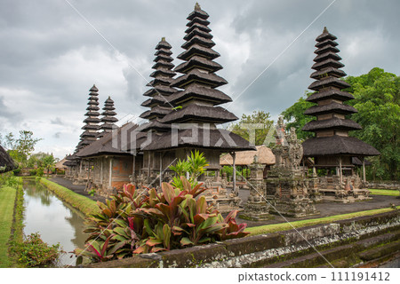 Scenery view of popular temple in Bali named Pura Taman Ayun the royal temple of Mengwi empire in Badung Regency, Bali, Indonesia. View in the Cloudy day. 111191412