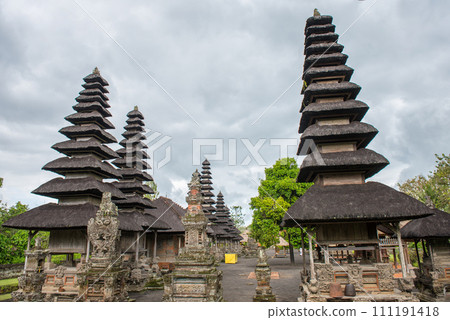 One of the popular temple in Bali named Pura Taman Ayun the royal temple of Mengwi empire in Badung Regency, Bali, Indonesia. View in the Cloudy day. One of the popular temple in Bali named Pura Taman Ayun the royal temple of Mengwi empire in Badung Regency, Bali, Indonesia. View in the Cloudy day. 111191418
