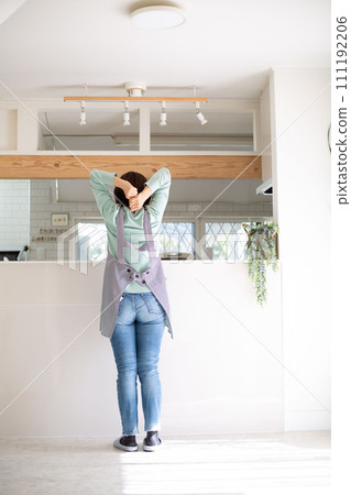 A middle-aged Japanese woman suffering from migraines 111192206