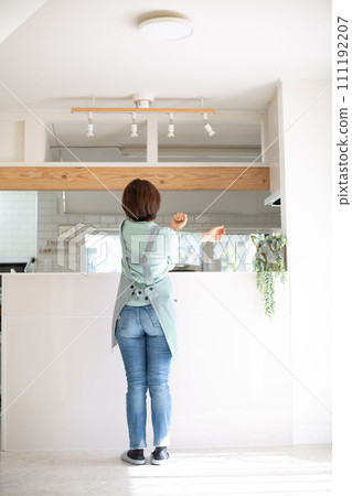 A middle-aged Japanese woman suffering from migraines A middle-aged Japanese woman suffering from migraines 111192207