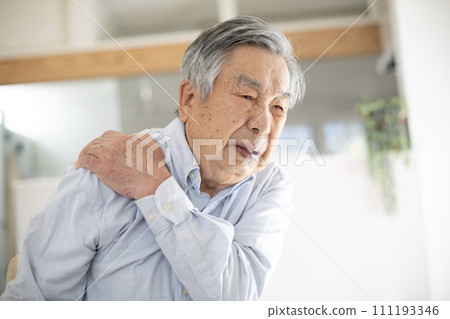 Japanese senior man suffering from stiff shoulders Japanese senior man suffering from stiff shoulders 111193346