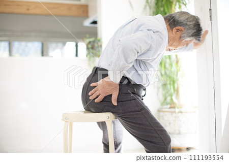 Japanese senior man suffering from back pain and incontinence 111193554