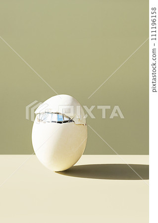 Cracked easter egg. Minimalist creative still life. 111196158