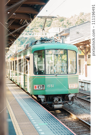 Enoshima Dentetsu train Line in Kamakura, Japanese railway connects Kamakura in Kamakura with Fujisawa Station in Fujisawa, Kanagawa. Landmark attraction near Tokyo. Kanagawa, Japan, 16 November 2023 111196491
