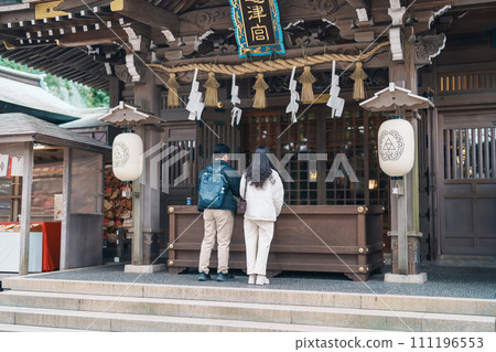 tourist Visiting in Enoshima Island, Fujisawa, Kanagawa, Japan.Traveler sightseeing Enoshima Shrine. Landmark and popular for tourists attraction near Tokyo. Kanagawa, Japan, 16 November 2023 111196553