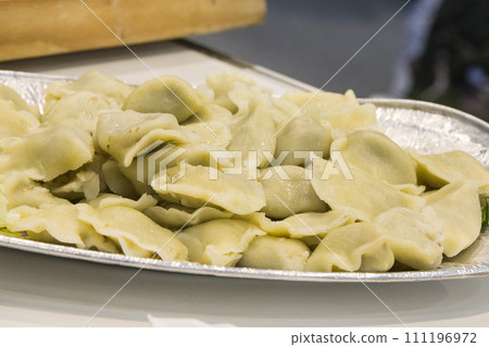 Fresh prepared dumplings. Traditional polish food Fresh prepared dumplings. Traditional polish food 111196972