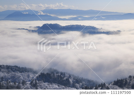 An island surrounded by a sea of clouds An island surrounded by a sea of clouds 111197500