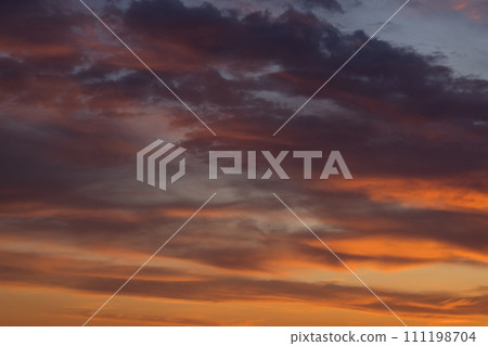 Epic sunset with beautiful colored clouds 111198704