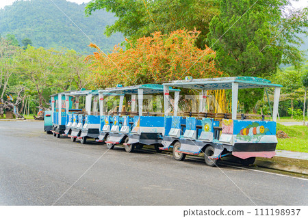 Passenger trailers. Steam trains for tourists in Yang Bay Park near Nha Trang in Vietnam. Passenger trailers. Steam trains for tourists in Yang Bay Park near Nha Trang in Vietnam. 111198937