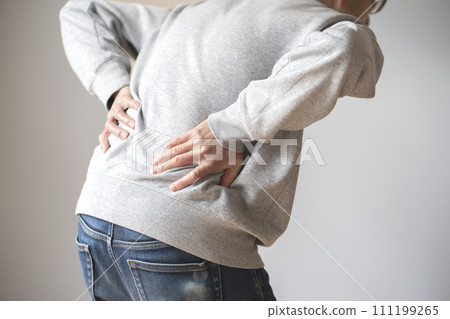 Man with back pain, body parts, faceless, back view Man with back pain, body parts, faceless, back view 111199265