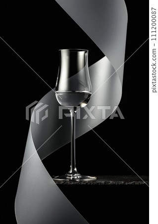 Vodka on a black background. 111200087