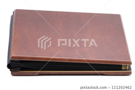 Brown photo book with wood cover isolated on white background. 111202462