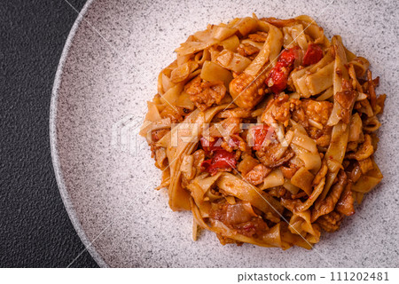 Delicious asian udon dish with vegetables, mushrooms, salt and spices 111202481