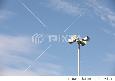 Whire horn speaker with cloud on blue sky background.. Whire horn speaker with cloud on blue sky background.. 111203193