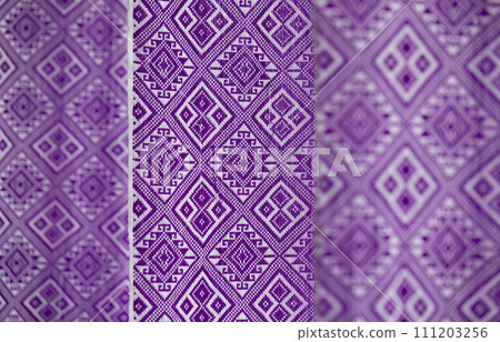 Indego Tai Lue woven fabric from northern of Thailand. (Selective focus). Indego Tai Lue woven fabric from northern of Thailand. (Selective focus). 111203256